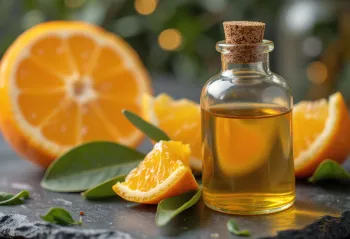 Flacon d'huile essentielle d'orange douce avec fruits frais