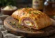 Stromboli au basilic, fromages frais et garnitures épicées, croûte dorée